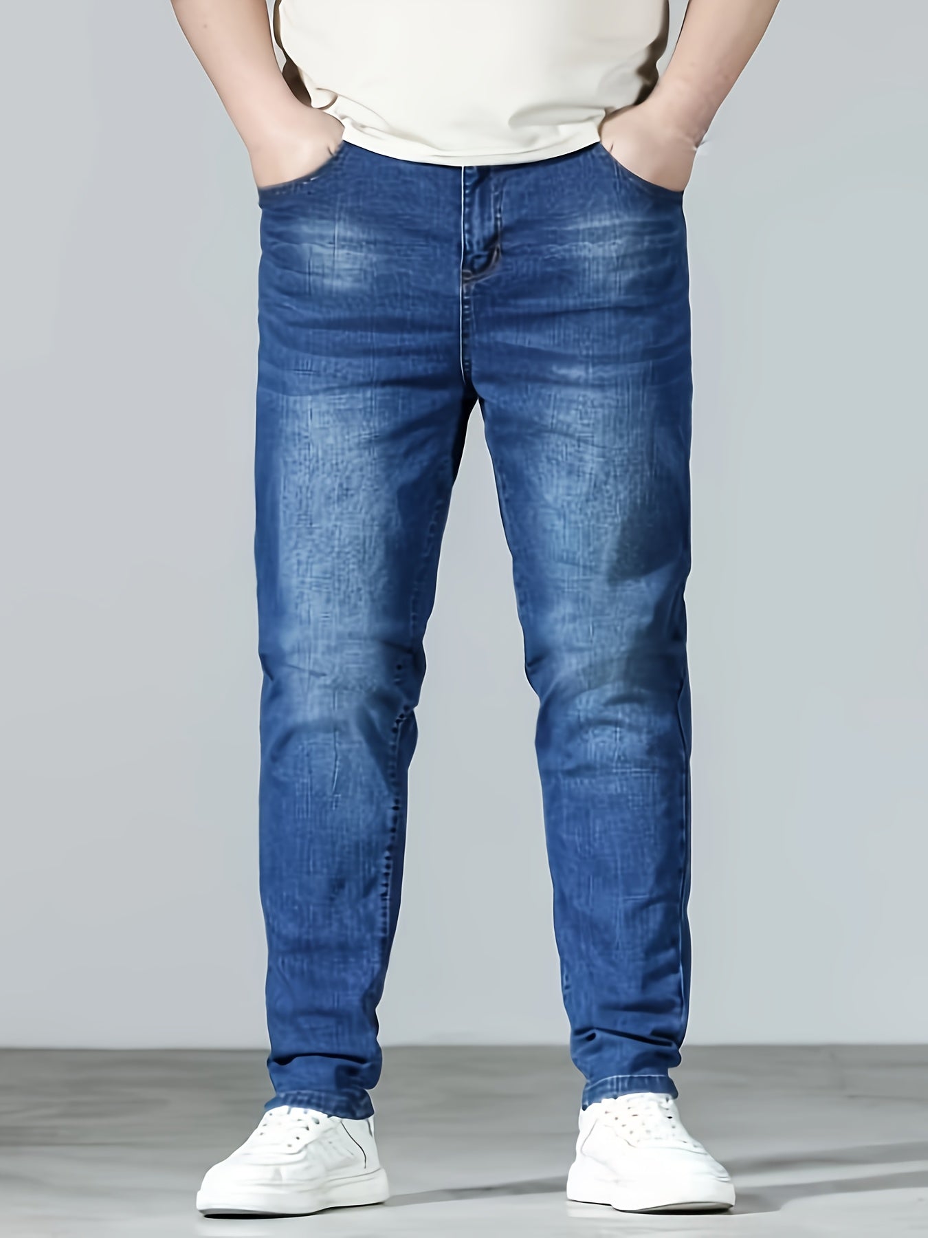 Plus size men's casual skinny fit denim jeans with medium stretch, solid color, pockets, suitable for all seasons.