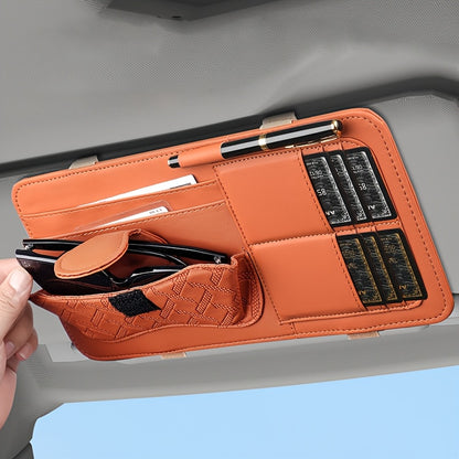 Car sun visor organizer with holders for glasses, cards, and pen.