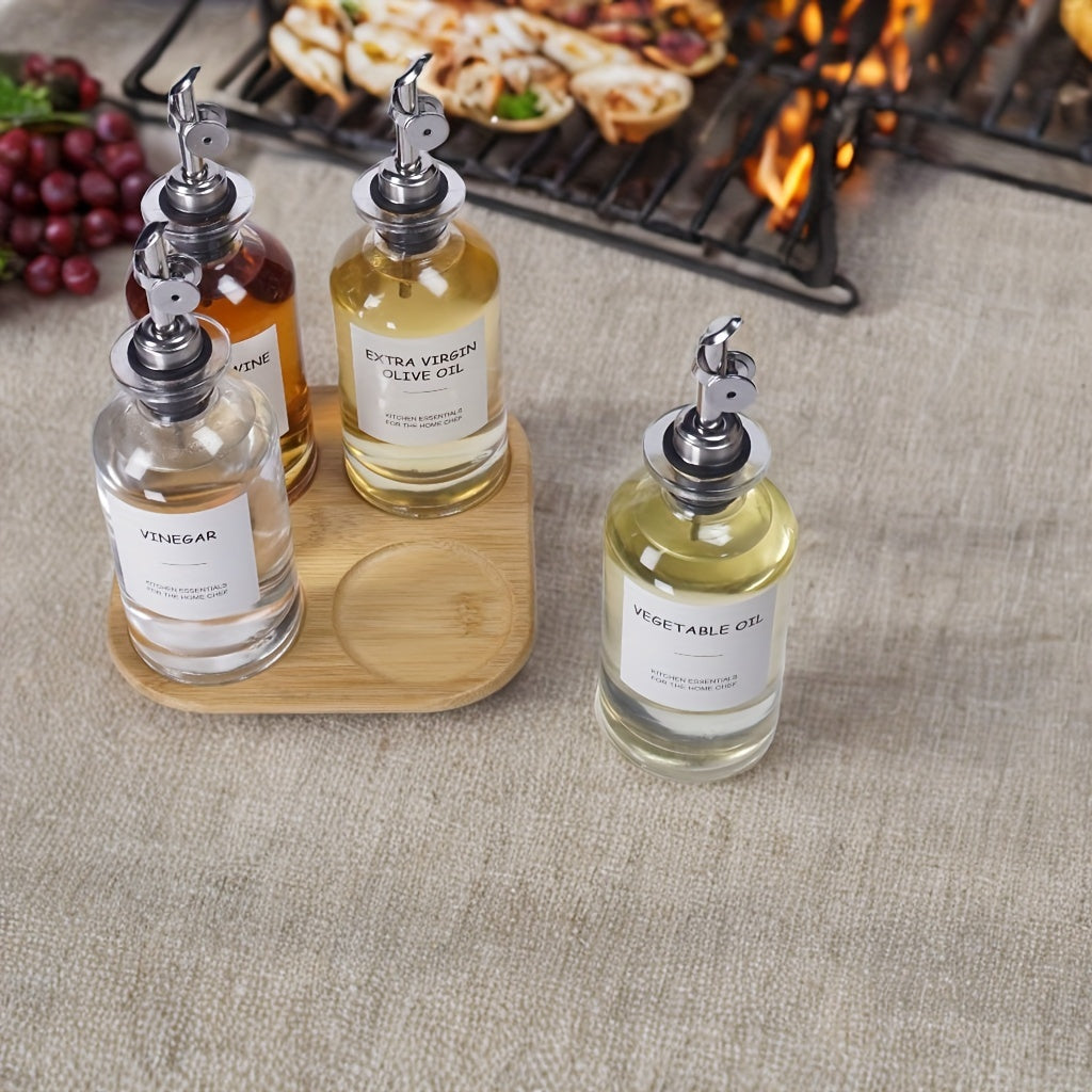 Set of 4 Automatic Opening and Closing Oil and Vinegar Containers including an Olive Oil Bottle, Zhenli Bottle, Transparent Oil Container, and Vinegar Bottle. Also includes a Seasoning Bottle for the kitchen. These leak-proof bottles are perfect for