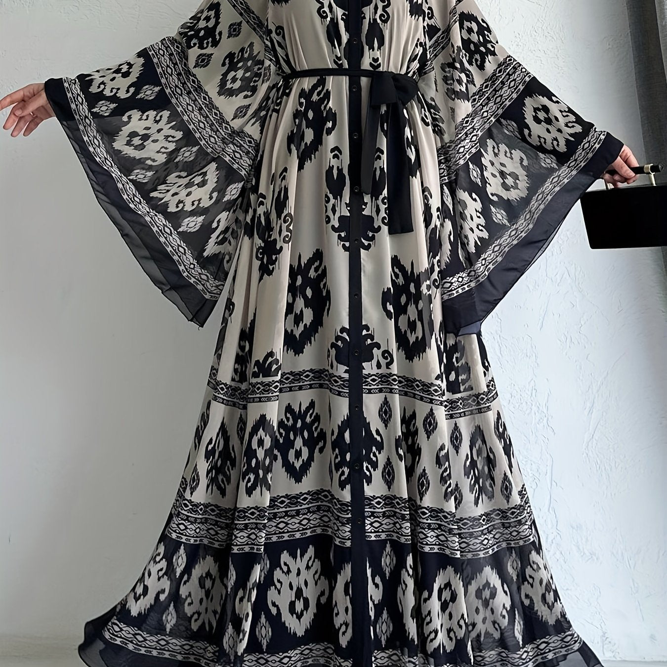 Allover print belted maxi dress with crew neck, bell sleeves, and pleats for spring & fall. Women's clothing.