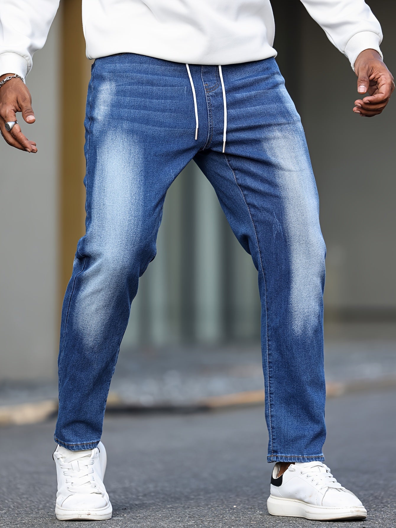 Plus size men's drawstring jeans and trendy denim pants for daily wear.