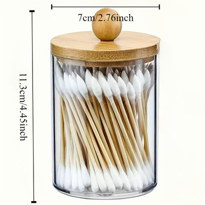 Stylish acrylic jar with wood lid for organizing swabs, makeup pads, and small items at home.