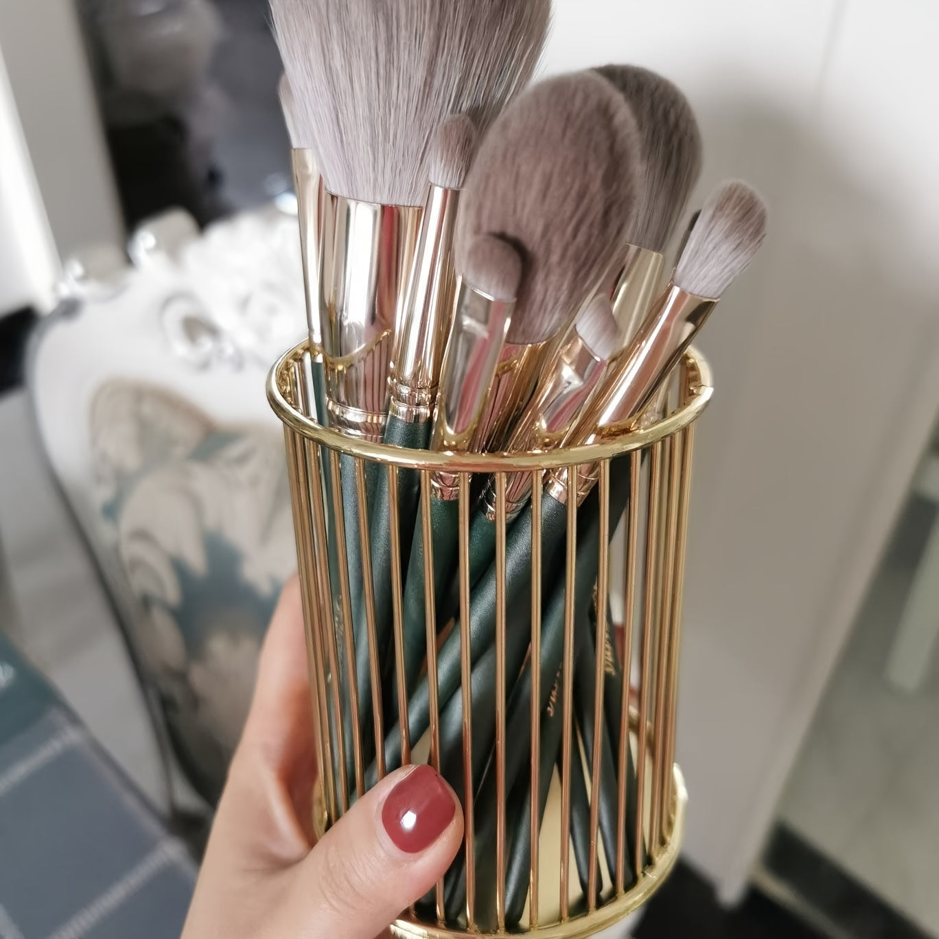 Stylish metal pen holders for makeup brushes, office supplies, and vanity storage.