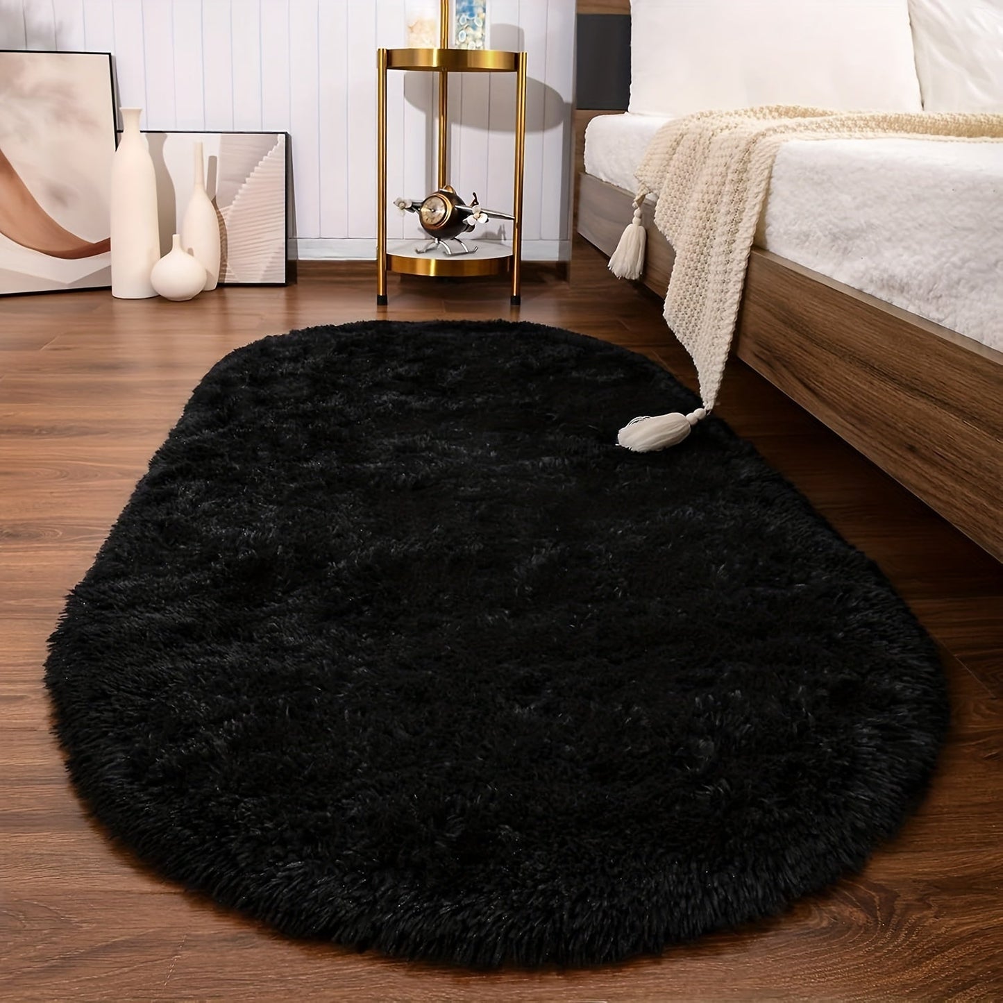 Soft and fluffy oval shaggy area rug, perfect for bedroom or living room. Made with skin-friendly thickened sponge and tufted polyester material. Durable and easy to maintain. Adds decorative touch to indoor spaces such as sofa, bedside, playroom, or