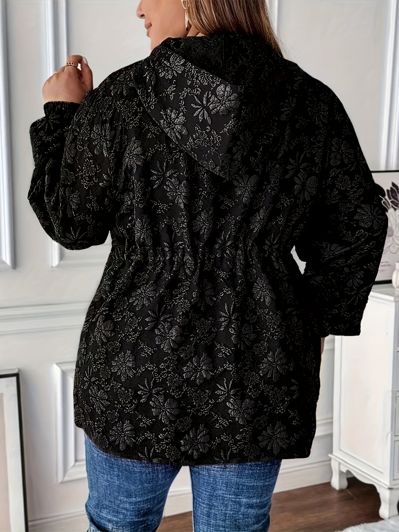 Stylish black floral jacquard hoodie jacket for plus-size women with drawstring and pockets.