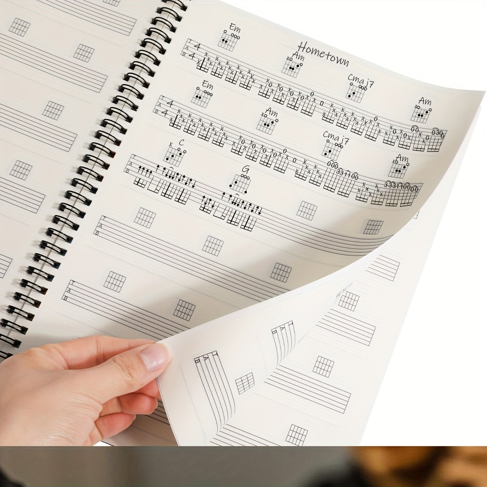 50-sheet guitar music creation and practice staff notebook with blank chord diagrams and 56 commonly used guitar chord diagrams on inside cover.