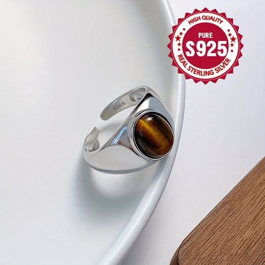 A versatile S925 silver ring adorned with a natural Tiger's Eye stone, offering impeccable quality and intricate design. Perfect for both men and women, showcasing a stunning appearance that is ideal for gifting or wearing on any occasion, whether it be