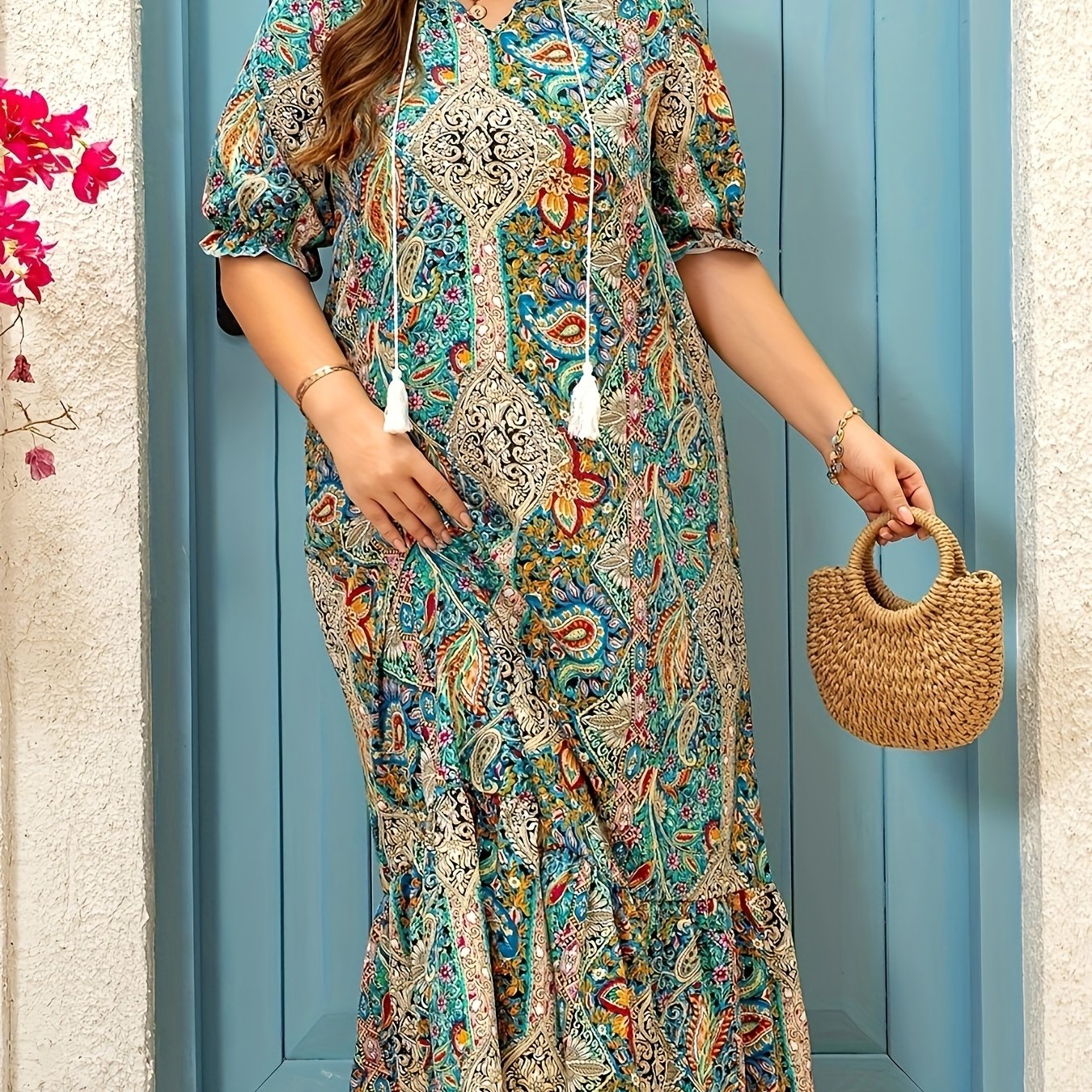 Stylish paisley print V-neck dress with ruffle hem and tassel detail. Made of polyester, machine washable. Perfect summer fashion for women.