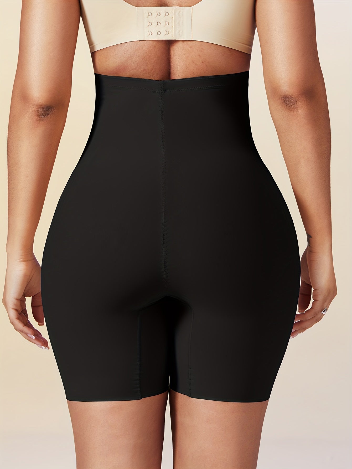 Seamless high-waist shapewear shorts for women with tummy control, ideal for slimming and enhancing body shape under dresses.