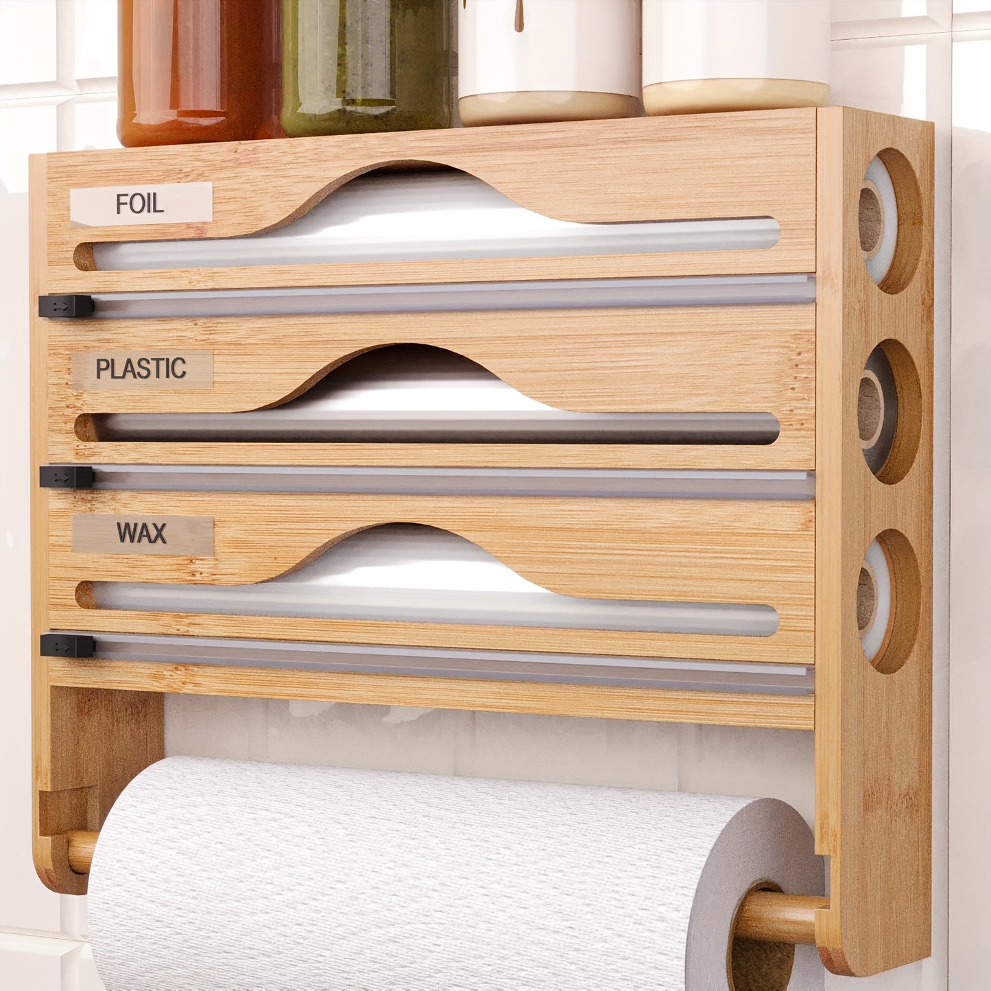 Bamboo wrap organizer with cutter and labels for wall-mounted kitchen storage.