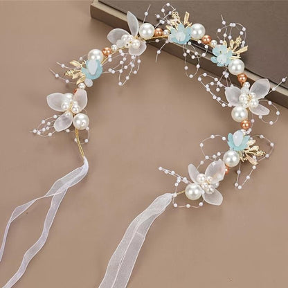 Elegant bridal headband featuring golden leaves, floral wreath, and faux pearls - ideal for weddings & special occasions