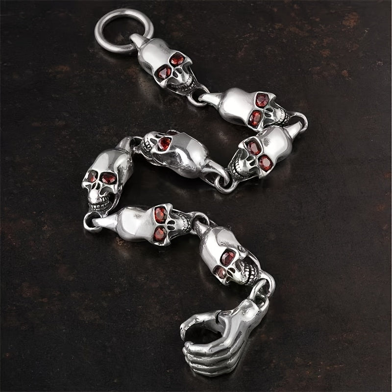 Vintage-inspired 925 sterling silver Gothic skull bracelet featuring a striking red eye charm. This adjustable punk style jewelry is ideal for couples and is perfect for daily wear and music festivals.