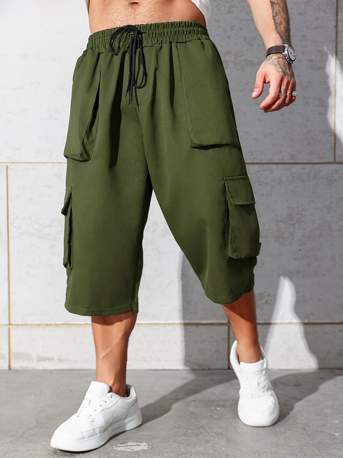 Men's relaxed fit knee-length cargo capri pants with multiple pockets and drawstring waist in plus size.