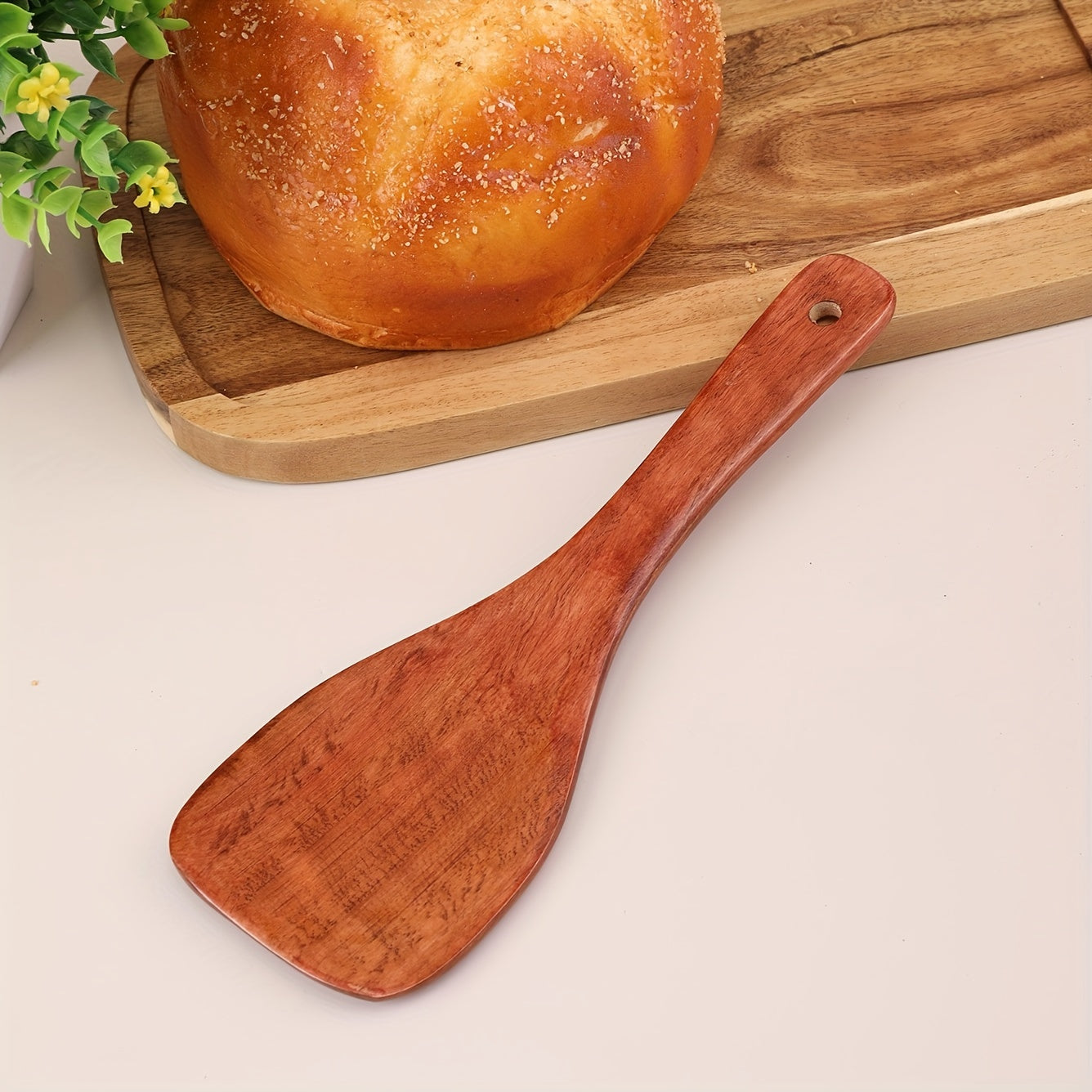 Eco-friendly wooden rice paddle and serving spoon for easy, healthy cooking.