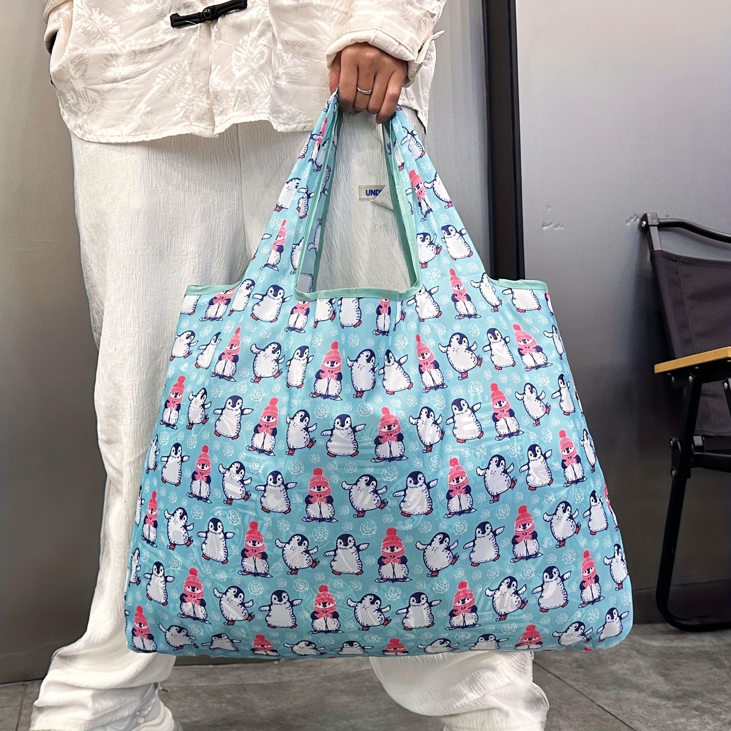 Durable and Lightweight Penguin Pattern Tote Bags - Perfect for Shopping, Groceries, and Everything in Between! These reusable and foldable totes are also recyclable, water resistant, and compact enough to fit in your pocket.