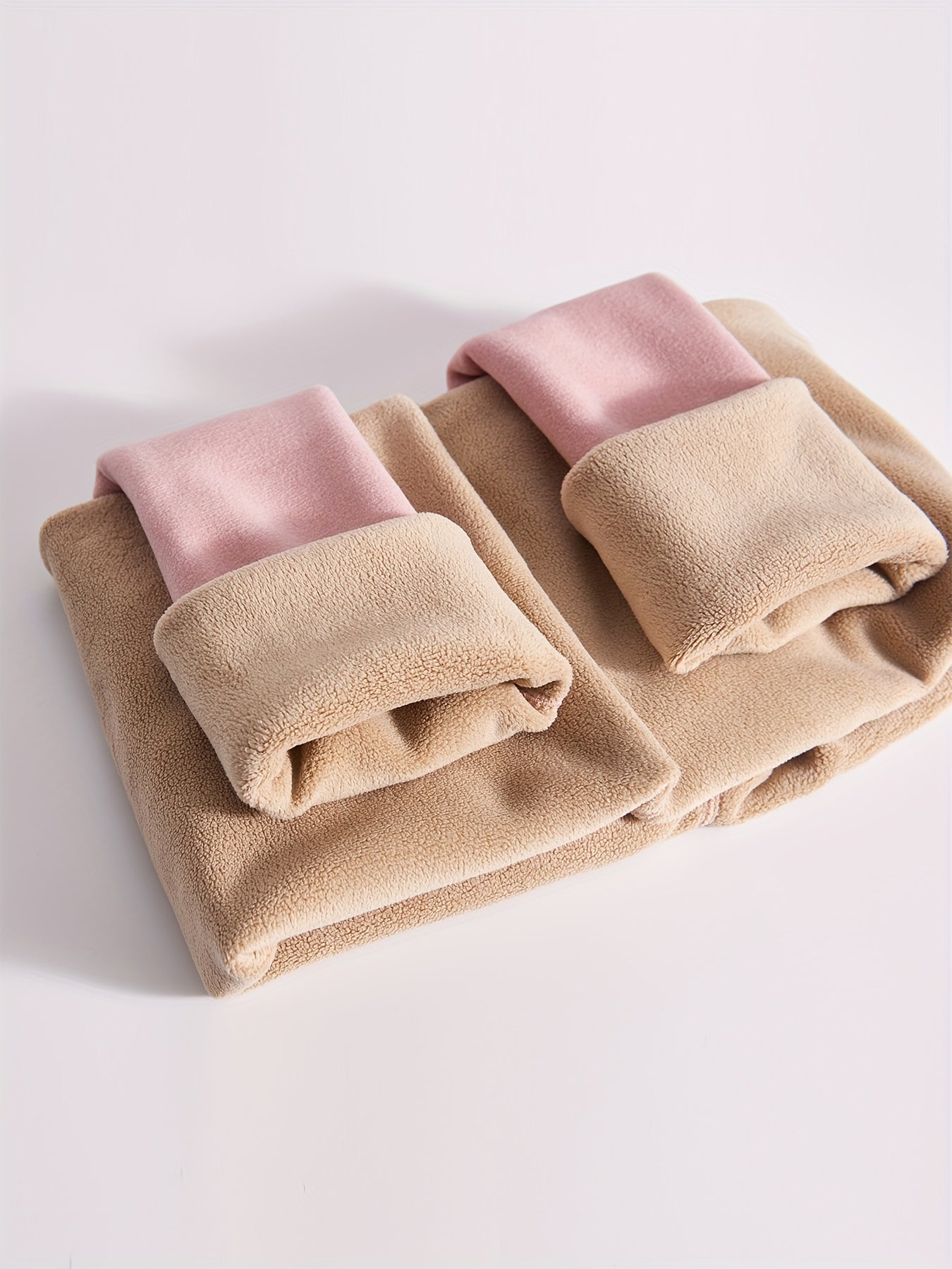 High waist fleece-lined leggings in pink and beige for autumn/winter, providing warmth and tummy control with a butt lift effect for workouts.