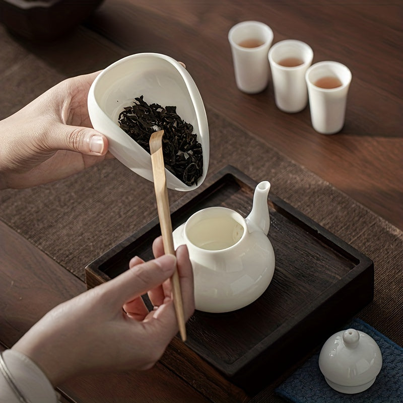 This exquisite white porcelain coffee and tea serving set features dose trays, spoon, and shovel, making it an ideal addition to your Christmas kitchen decor.