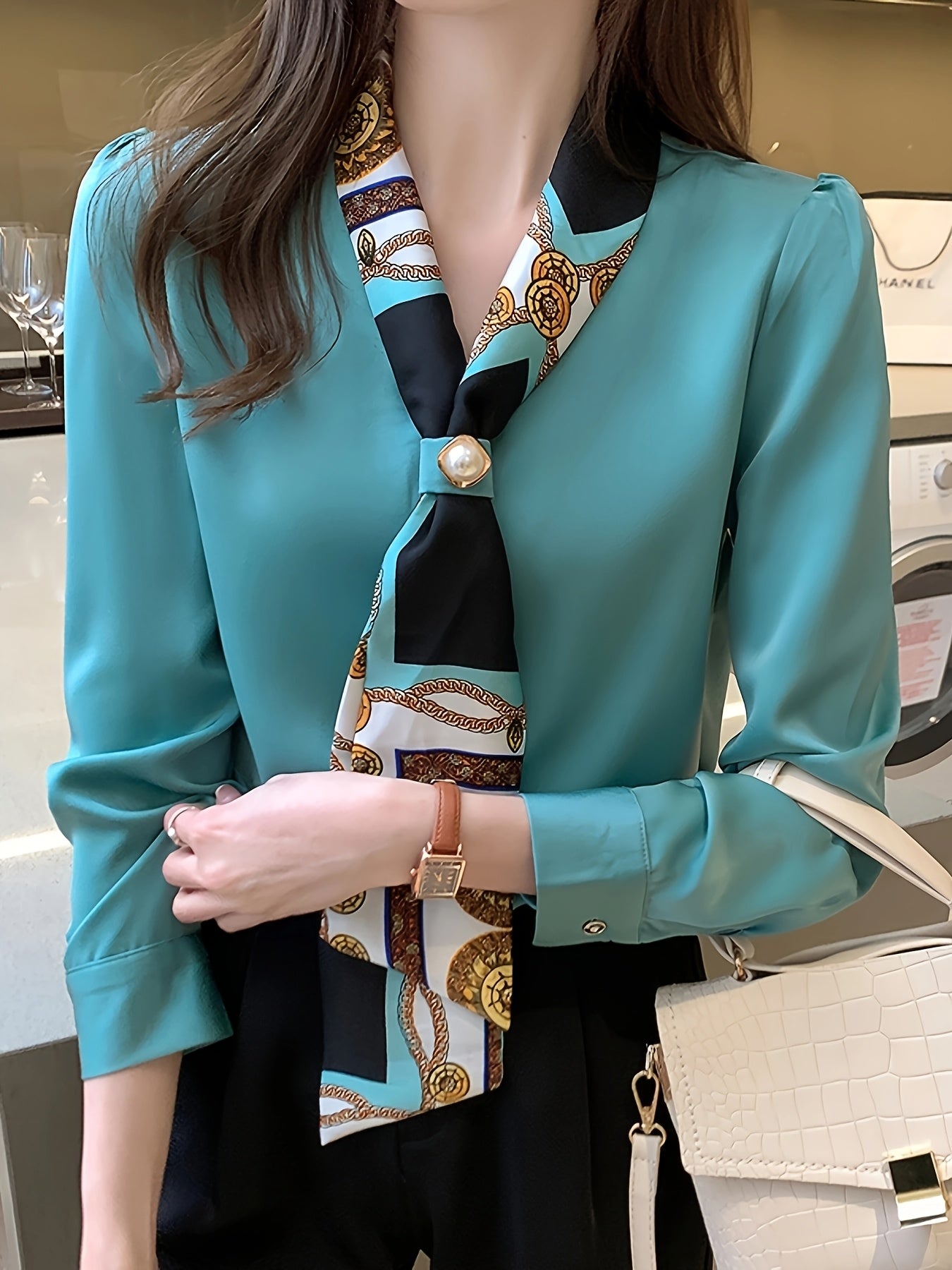 Polyester tie neck blouse with long sleeves, button detail print for women. Regular fit woven top, fashionable all-season style.