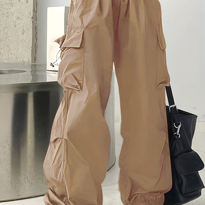 Wide leg cargo pants with flap pockets, drawstring closure. Perfect for spring and summer. Women's casual clothing.