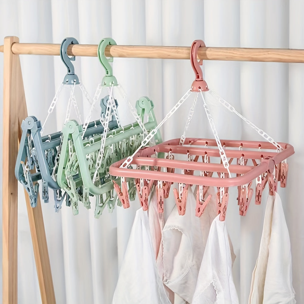 This durable foldable hanger features a large capacity with 32 clips, making it perfect for storing socks and underwear in the bathroom, bedroom, closet, or wardrobe. Available in pink, blue, and green, this plastic hanger is a convenient solution for