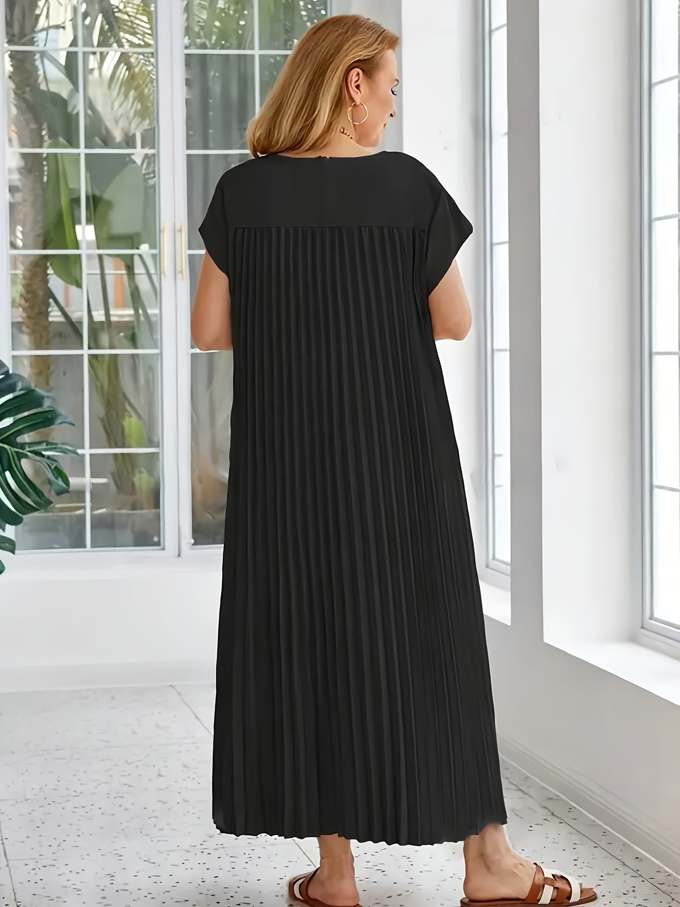 Women's solid blue pleated A-line tunic dress with crew neck, short sleeves, and flared hem, made of non-stretch polyester. Loose silhouette perfect for vacation style. From the