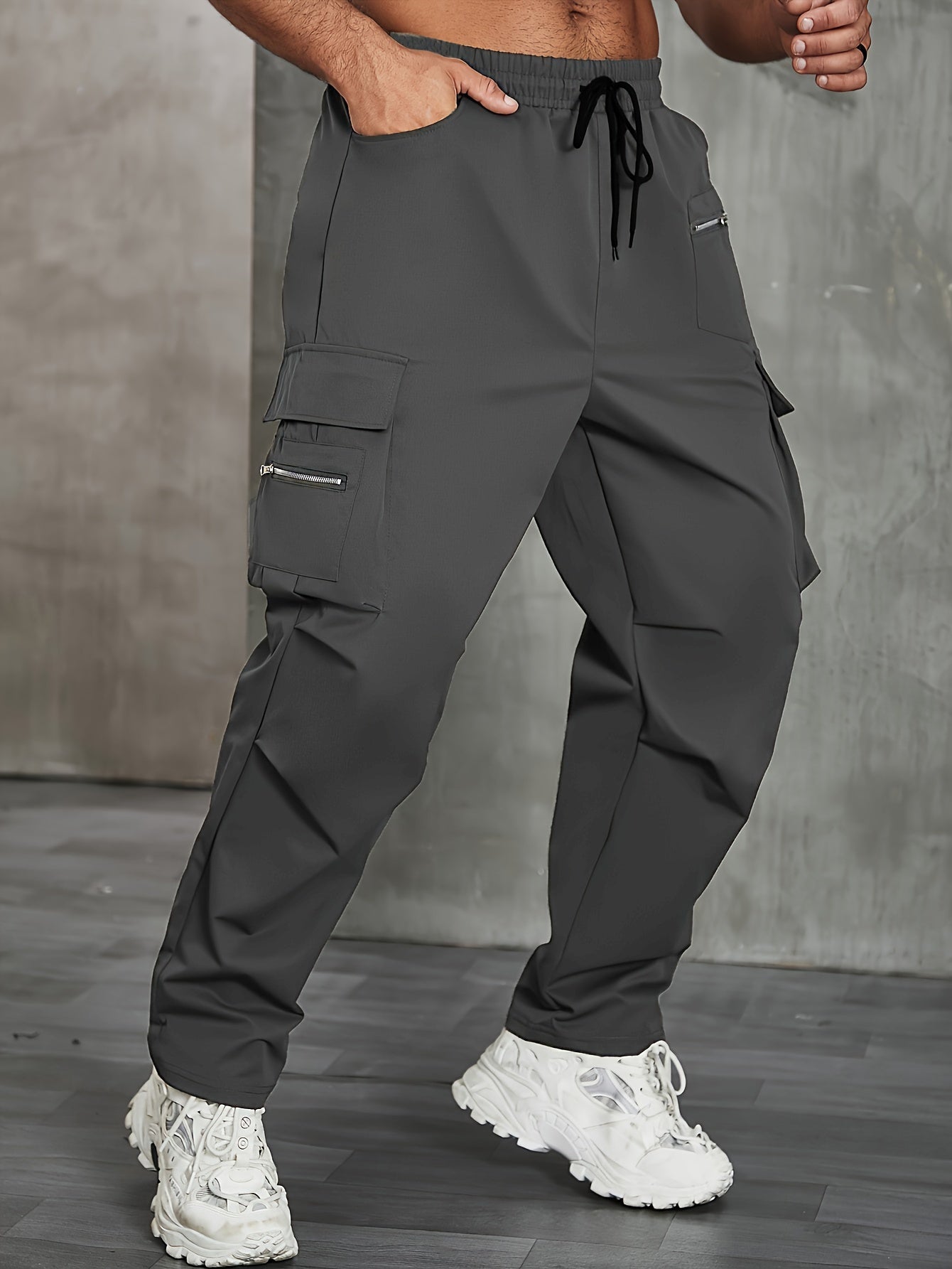 Men's solid cargo pants in plus sizes for spring and fall outdoor sports.