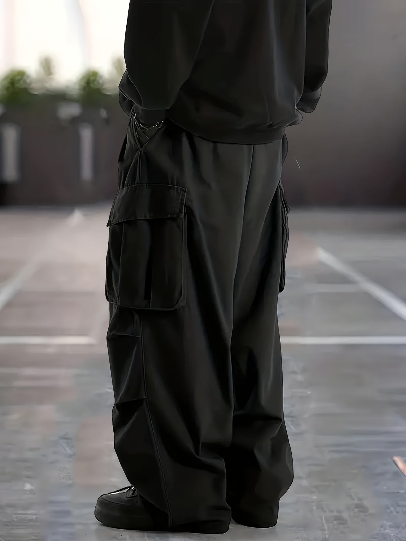 Men's plus size cargo pants made of 100% polyester with multi-pocket design, straight leg fit, and waterproof fabric. Perfect for outdoor activities and travel, available in big and tall