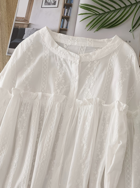 Lace-trimmed long sleeve blouse with ruffled collar, loose fit, and semi-sheer design. Button-up style in solid white, ideal for casual wear.