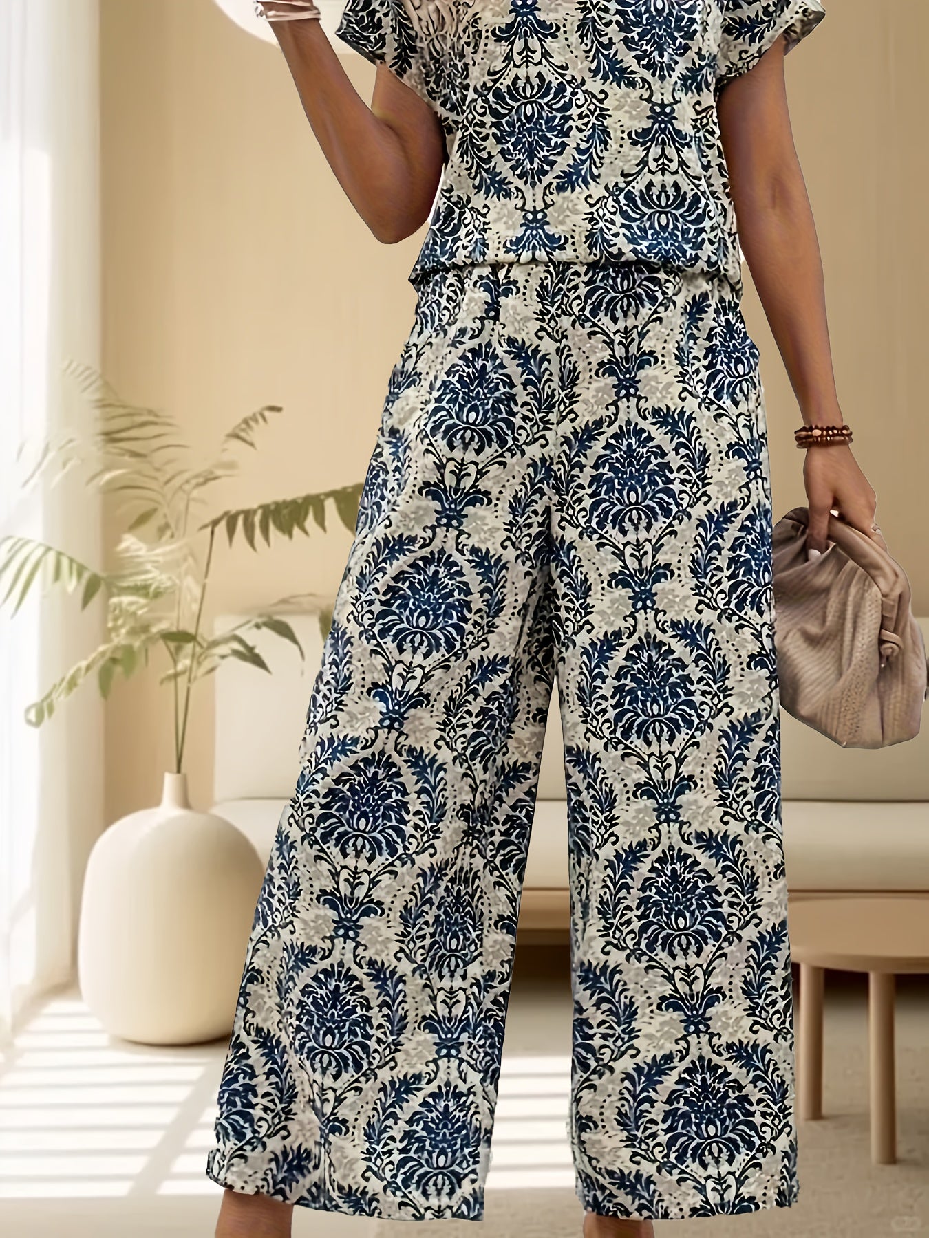 Retro print casual vacation shirt and wide leg pants set for women, summer season.