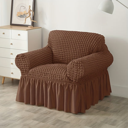 Non-slip elastic sofa cover with skirt for home decor.