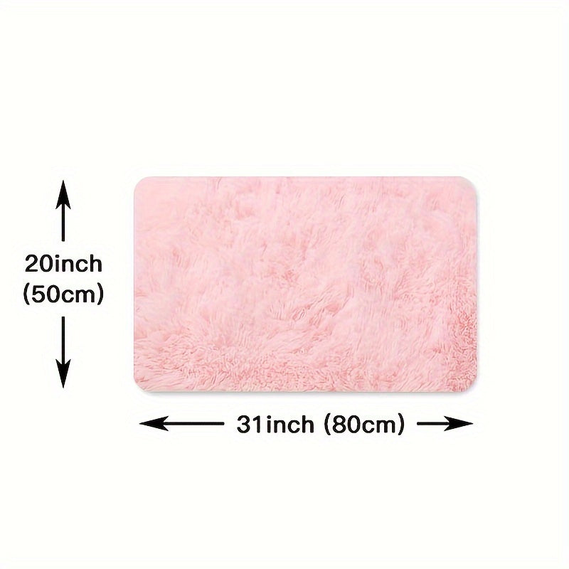 This solid pink polyester area rug is both fluffy and durable, making it perfect for any room in your home or office. The non-slip backing ensures safety, while the stain-resistant material is easy to clean with dry cleaning. This machine-made