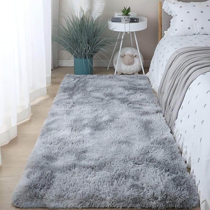 One piece of plush, fluffy area rug designed for bedrooms. This soft, fuzzy shaggy rug is black in color and rectangular in shape, perfect for adding warmth to your living room. It features a non-slip bottom to ensure safety. Great for Halloween or