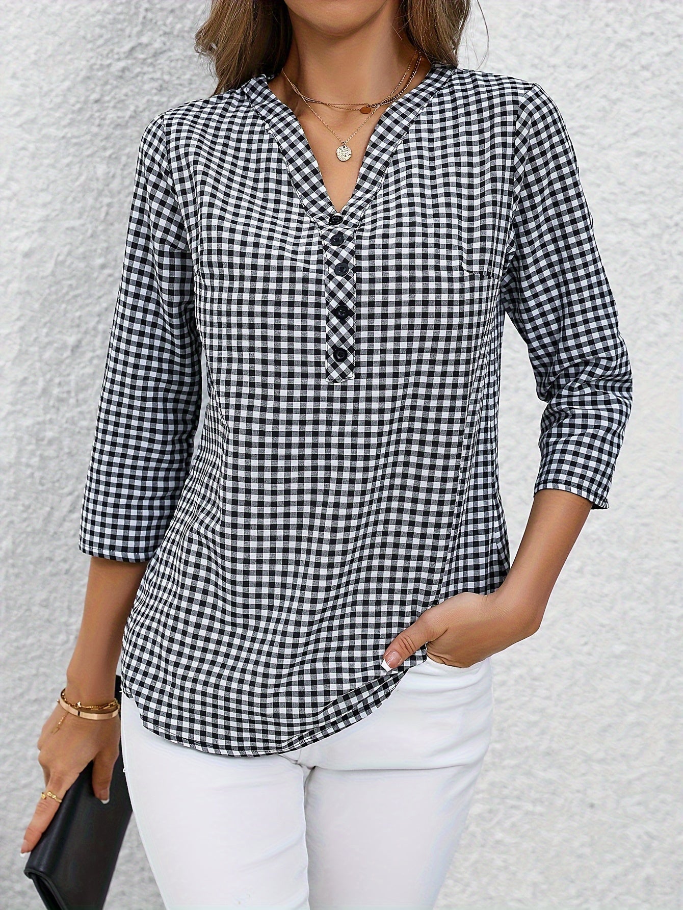 Women's yellow & white plaid button-up shirt with v-neck, long sleeves, and polyester fabric. Casual wear.