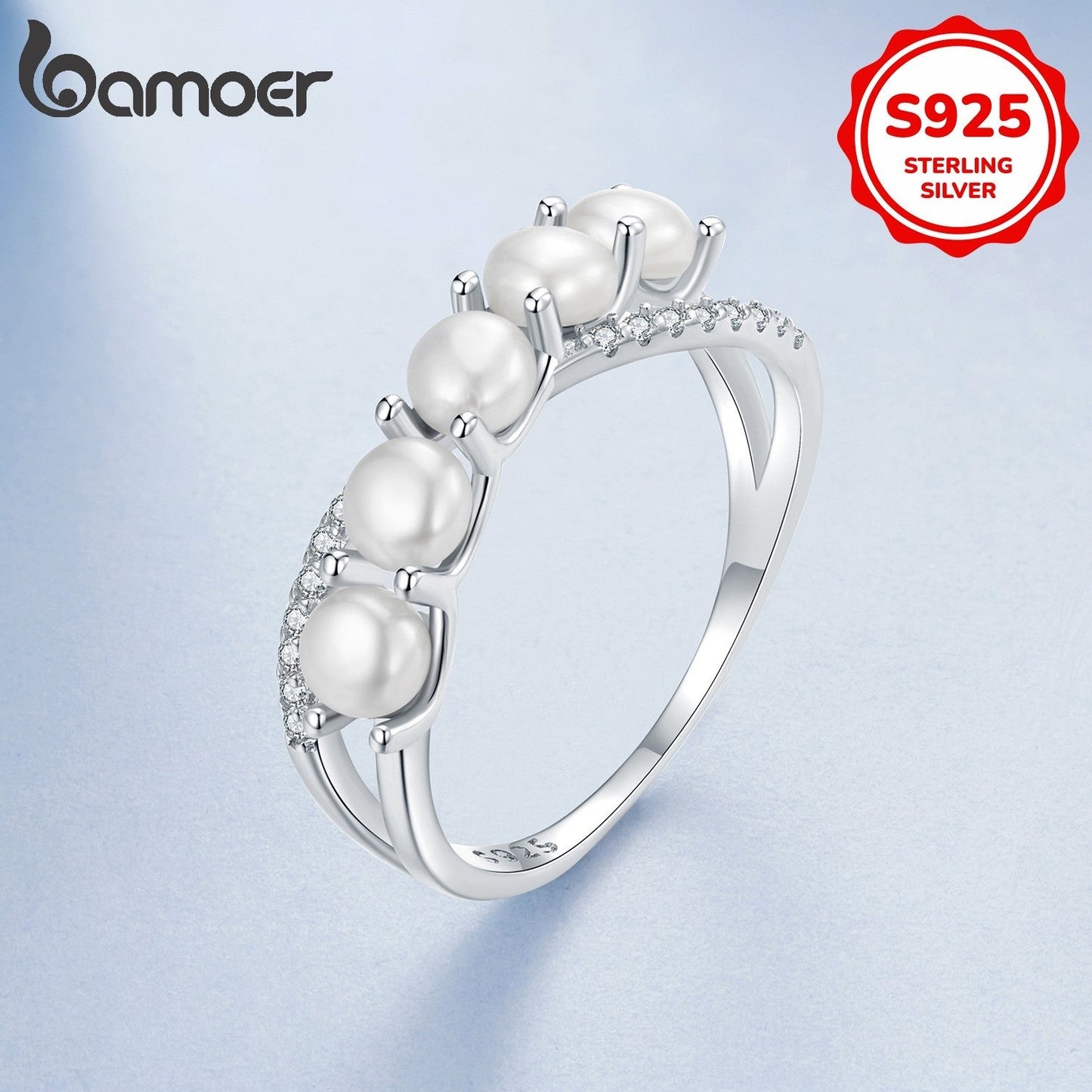 Celebrate a special occasion with this elegant women's anniversary ring, showcasing a stunning infinity symbol design crafted from 3.2 grams of 925 silver and adorned with lustrous freshwater pearls. This versatile piece is ideal for daily wear or as a