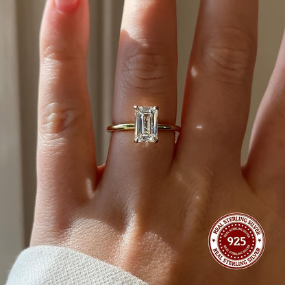 This stunning 925 Sterling Silver ring features a rectangular Cubic Zirconia stone, exuding elegance and luxury. It is perfect for both casual wear and gifting, with its simple yet sophisticated golden design. The simulated diamond comes in sizes of 1CT