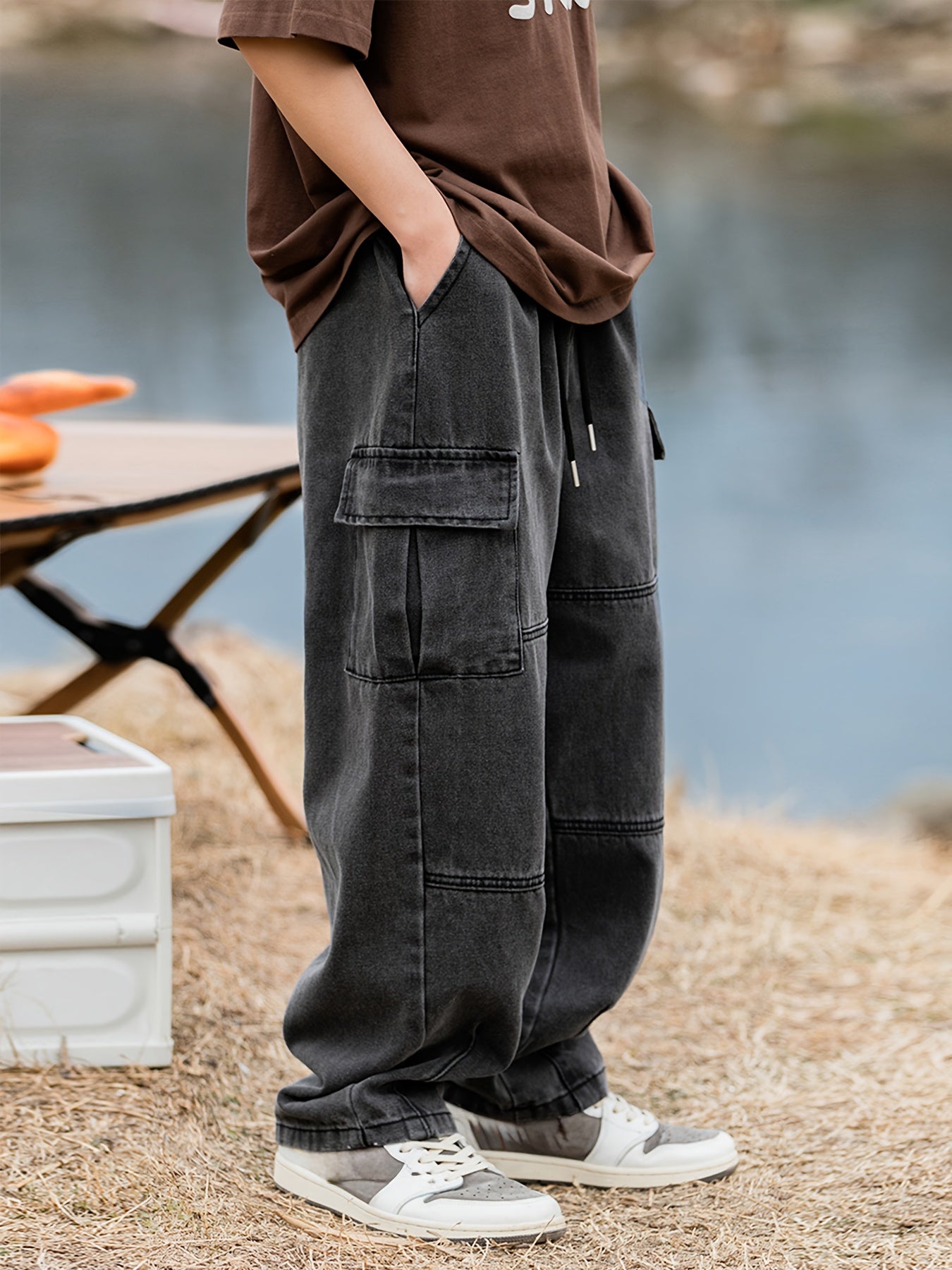 Men's cargo pants with multiple pockets and drawstring, ideal for outdoor activities in spring and fall.