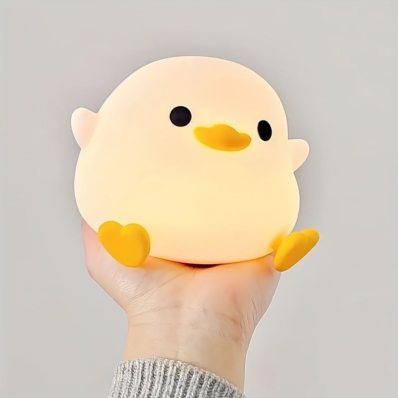 A whimsical Cute Duck-Shaped Table Lamp with a Geometric Pattern and White Matte Finish. This battery-powered lamp includes a switch, a plastic shade, and a G13 bulb base for ≤36V. Perfect for bedside reading or as a nursery night light, providing gentle