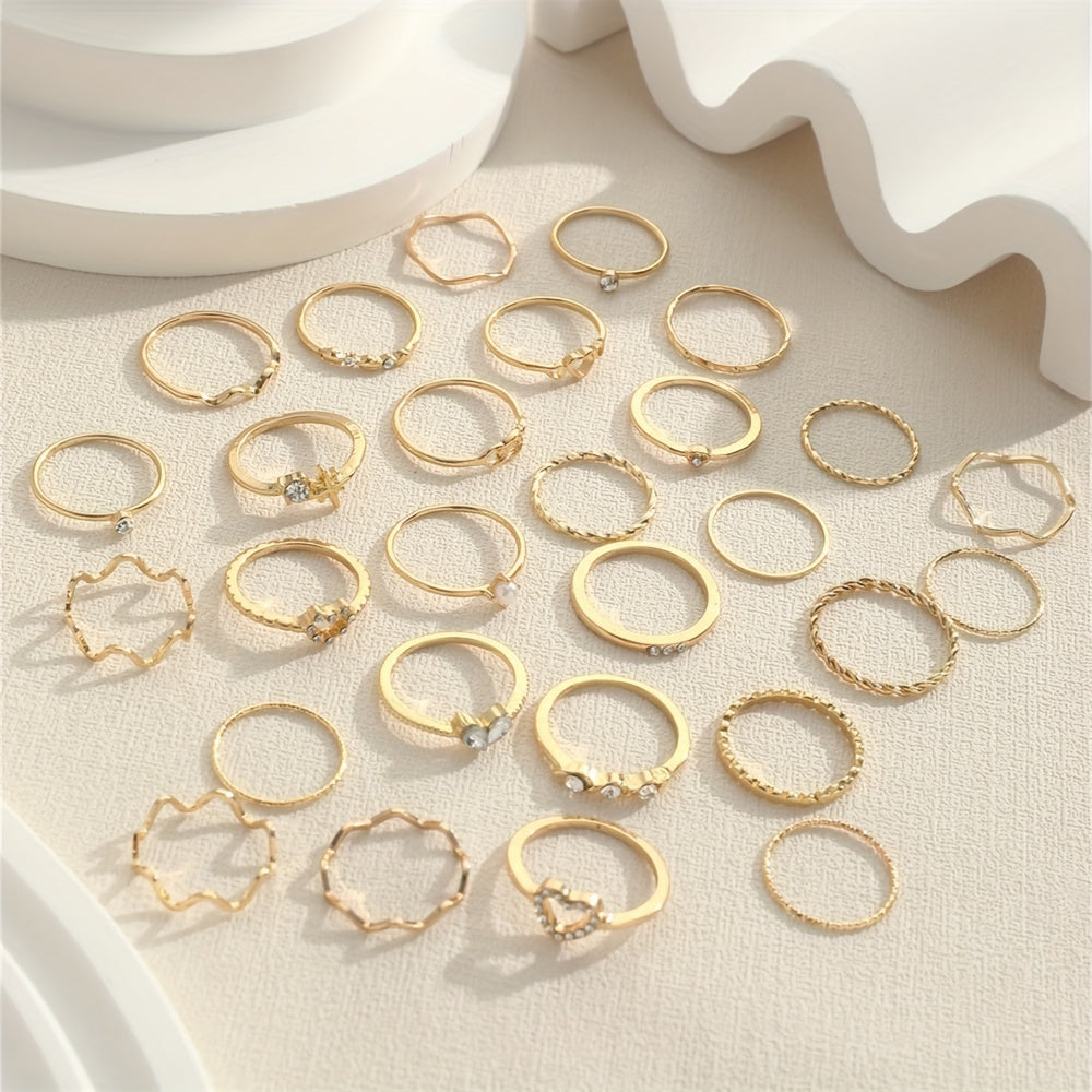 A 28-piece set of stylish alloy iron stacking rings with heart, geometric, and wavy designs for versatile wear.