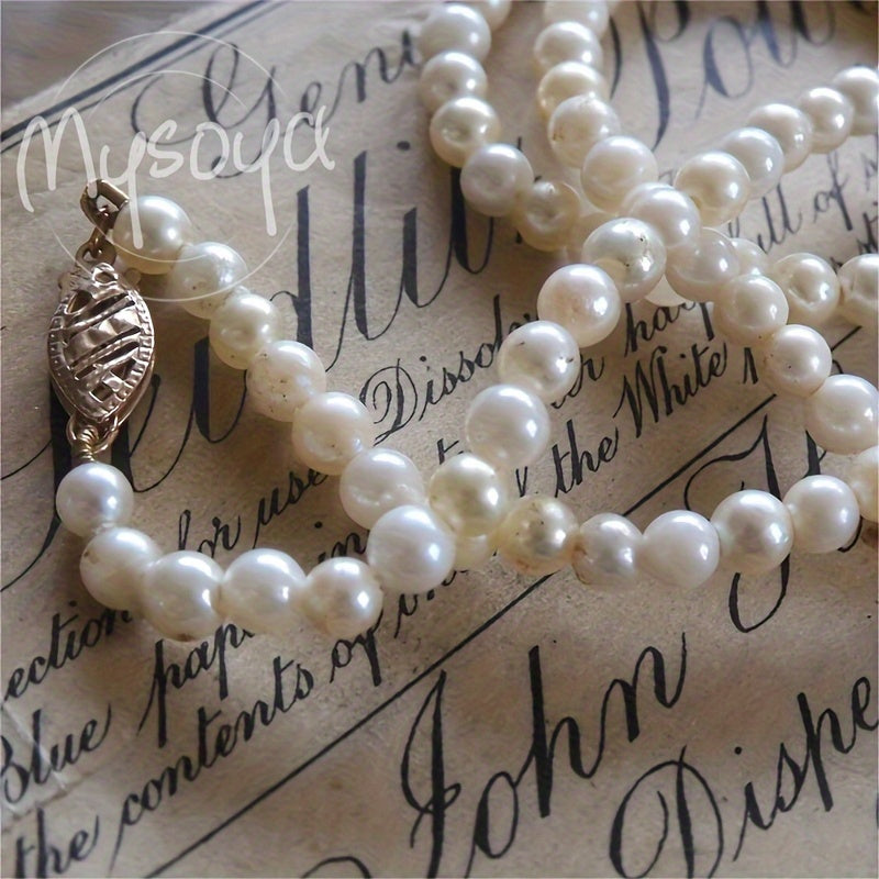 Elegant freshwater pearl necklace crafted by hand, featuring natural 6-7mm white pearls - the June birthstone. This luxurious piece is free of any plating and is perfect for both weddings and everyday wear. An ideal Valentine's gift, it comes with a