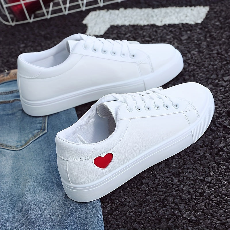 Stylish women's casual sneakers with heart-shaped design, lace-up style, and flat white soles - ideal for leisure wear.