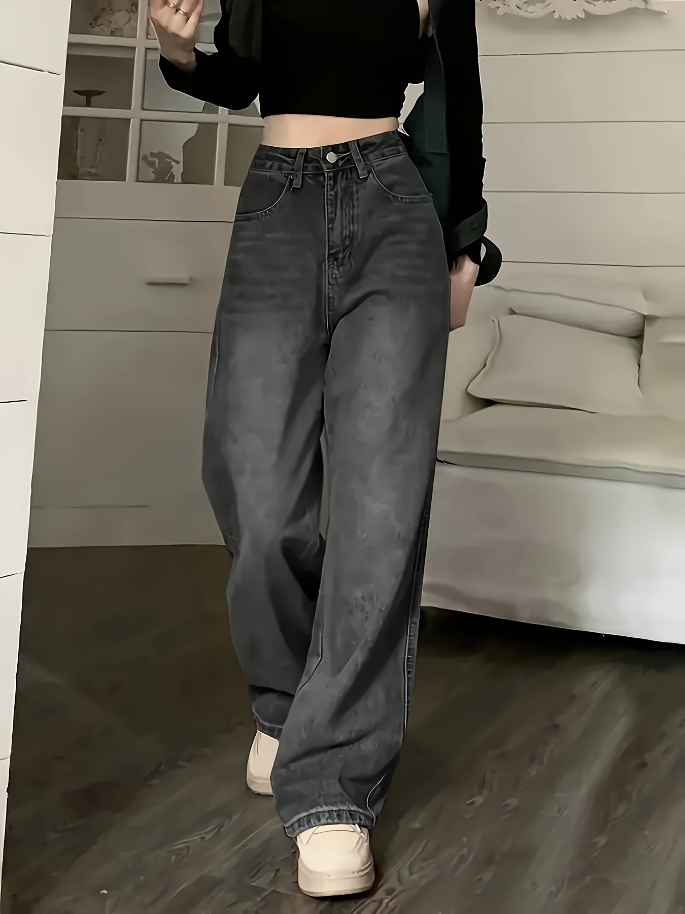 Women's high rise retro style jeans with loose fit and slant pockets.