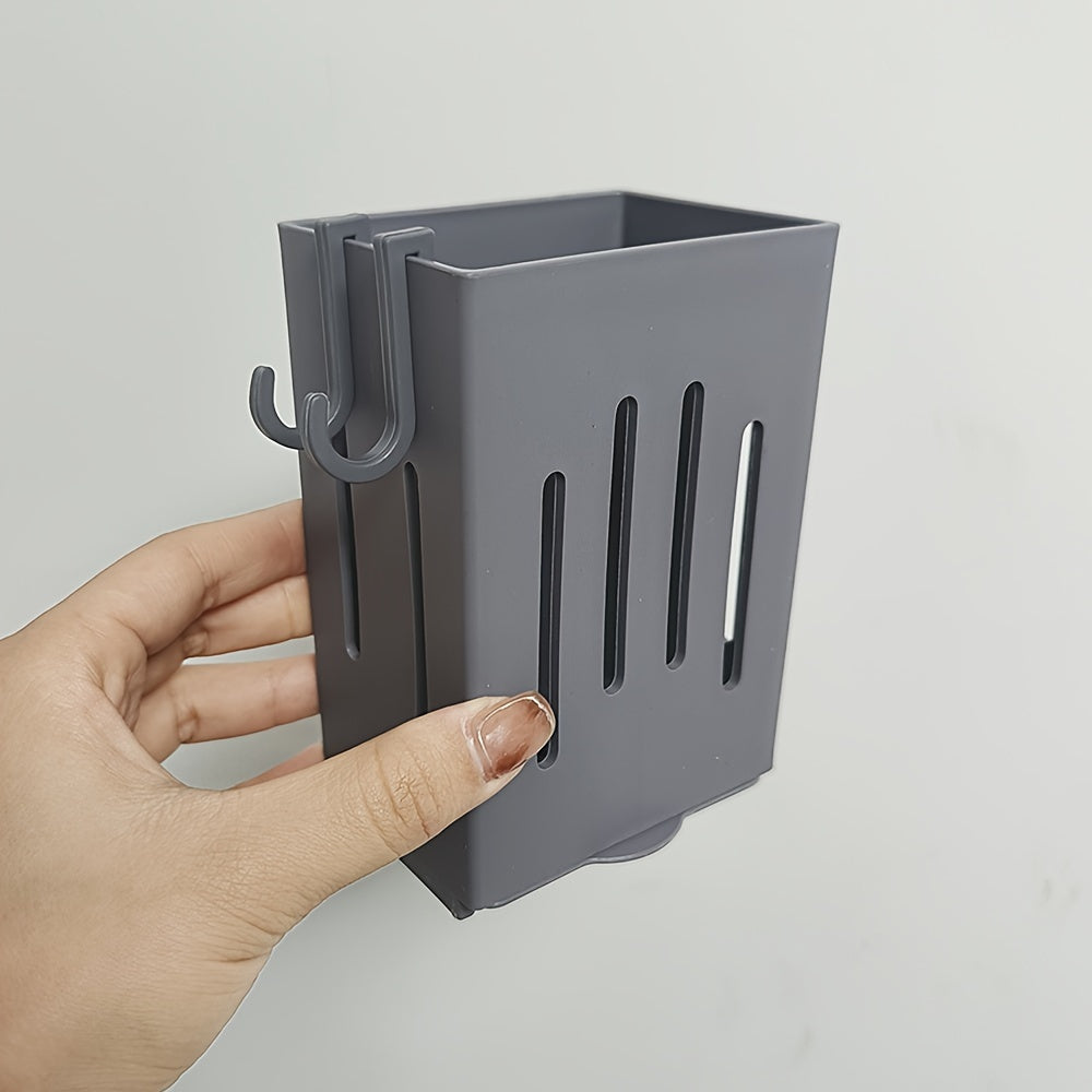 Organize your kitchen with this convenient wall-mounted storage rack! Made of durable plastic, this utensil holder features a chopstick cage with a drain tray, perfect for storing cutlery, knives, forks, spoons, sponge brushes, and more. No electricity