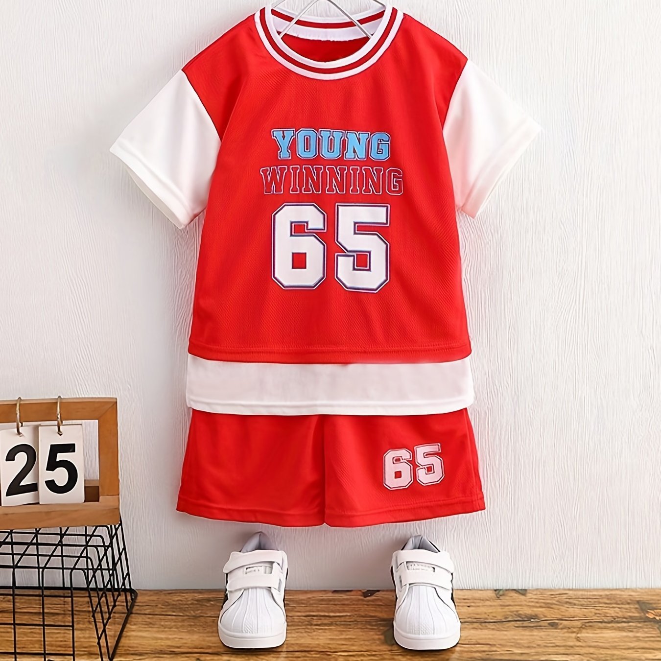 Boy's "Young Winning" casual outfit set includes a round neck t-shirt and shorts, perfect for daily and outdoor wear.