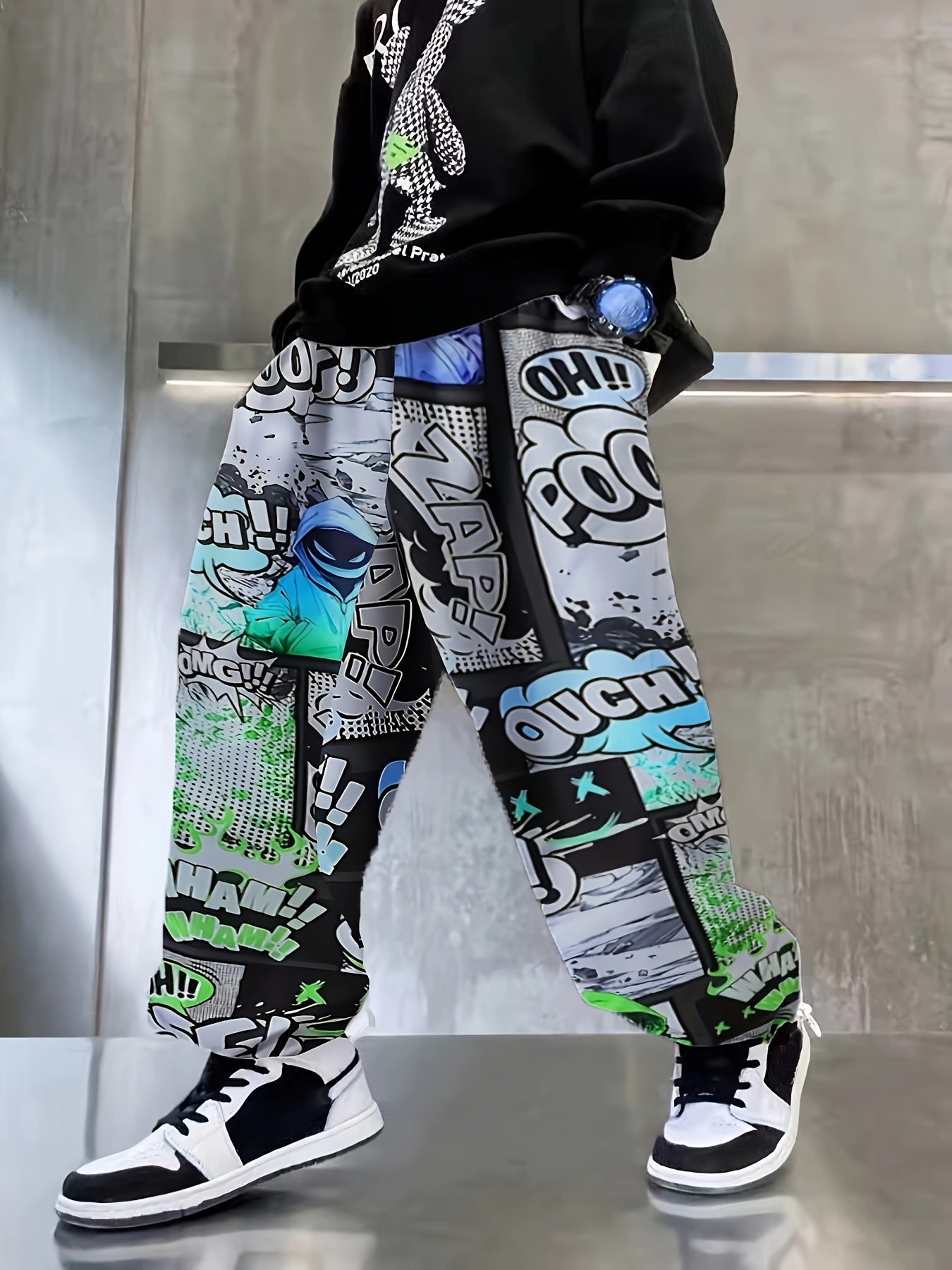 Comfy boys joggers with graffiti and ink splashes, elastic waist.