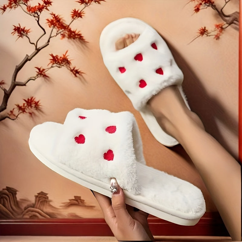 Heart-shaped plush slippers with soft soles, perfect for Valentine's Day in the bedroom.