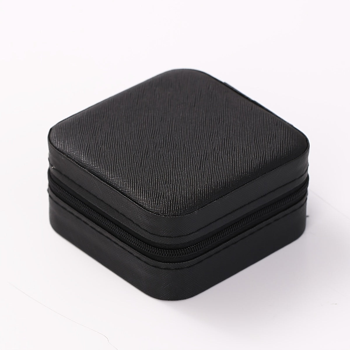 Portable jewelry storage box for traveling, suitable for earrings, necklaces, and rings. Simplistic organizer for jewelry.