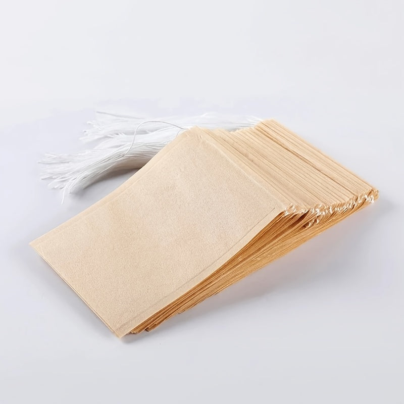 Pack of 100 Natural Biodegradable Drawstring Filter Paper Bags for Coffee, Tea, and Food - Convenient and Eco-Friendly - Disposable Tea Brewer and Empty Tea Bag infused with Pine Leaf Powder and Herbs - Ideal for Brewing and Serving