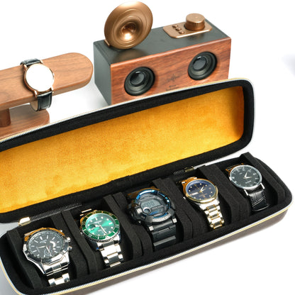 This top-of-the-line faux leather watch box is designed to store up to 5 watches. It features a durable hard shell, making it ideal for travel. The soft velvet lining ensures that your watches are protected, while the 5 customized shockproof pillows keep