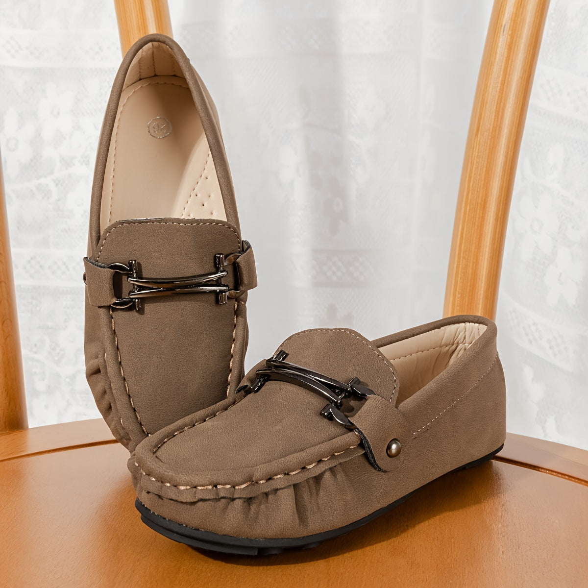 Boys' slip-on loafers in black and brown, suitable for all activities.