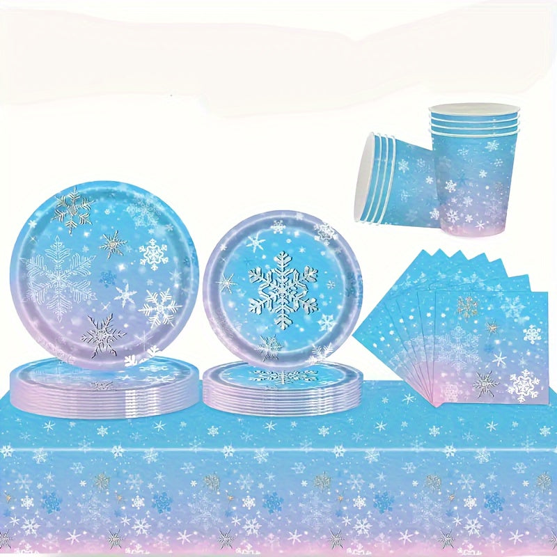 Frozen themed party tableware for 10 guests, including snowflake plates, cups, napkins, and dinnerware set. Perfect for a holiday birthday party or Christmas winter wonderland celebration. Ideal for Frozen birthday party decorations.